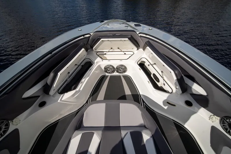 Slide: The Image of Luxurious 2020 MTI V42 boat interior with sleek seating and storage compartments. - 25