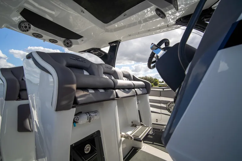 Slide: The Image of Interior of 2020 MTI V42 boat with luxurious seating and modern steering wheel. - 31