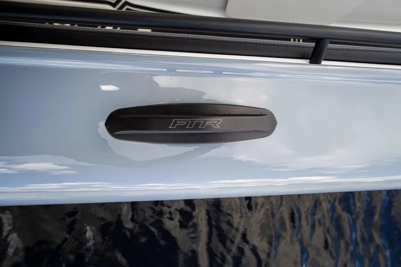 Slide: The Image of 2020 MTI V42 boat with FTR logo on sleek exterior. - 35