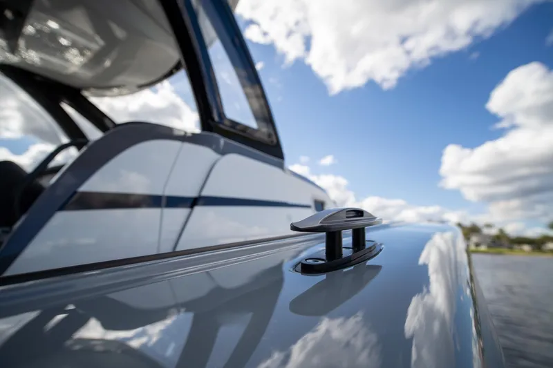 Slide: The Image of Close-up of 2020 MTI V42 boat cleat against a blue sky with clouds. - 36