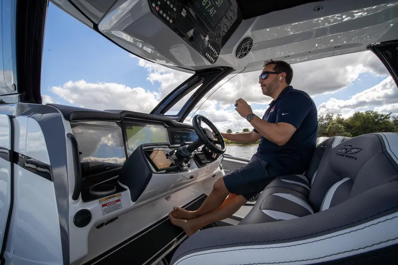 Slide: The Image of Man piloting 2020 MTI V42 boat under clear sky. - 38