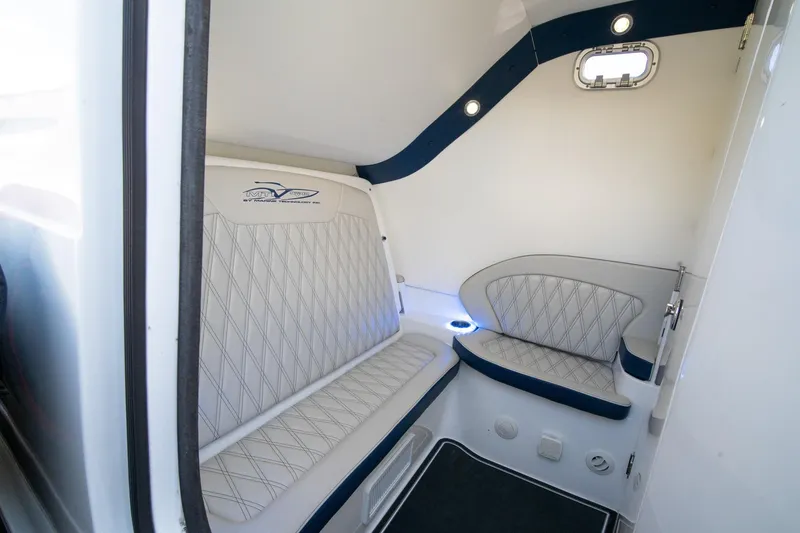 Slide: The Image of Interior cabin of 2020 MTI V42 boat with cushioned seating and modern design. - 40