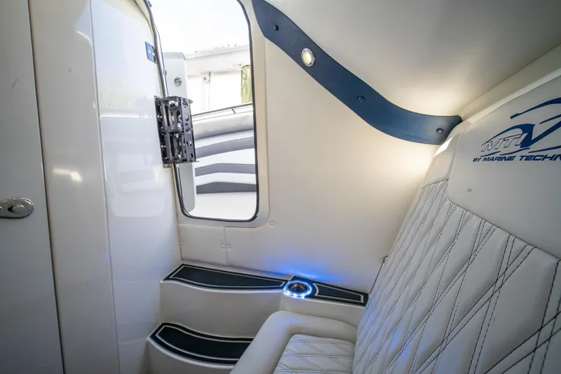 Slide: The Image of Interior of 2020 MTI V42 boat with modern seating and ambient lighting. - 46