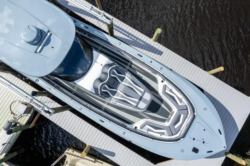 Slide: The Image of Aerial view of 2020 MTI V42 boat docked at a marina. - 58