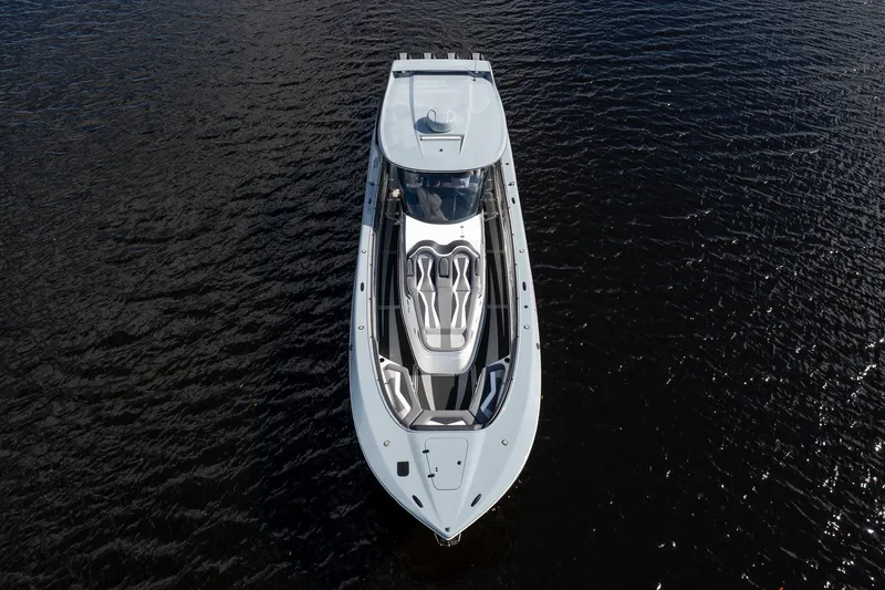 Slide: The Image of Aerial view of 2020 MTI V42 luxury yacht on dark water. - 60