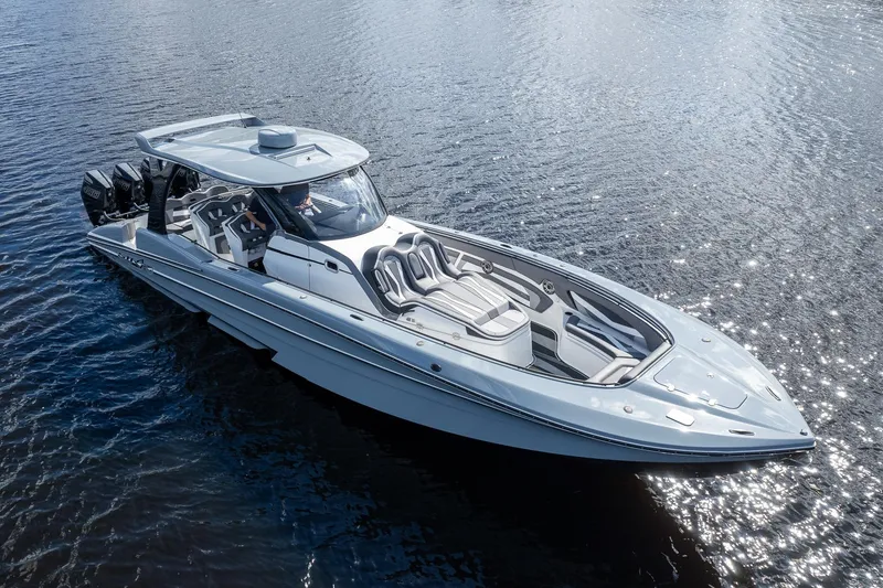 Slide: The Image of Luxury MTI V42 boat cruising on water, 2020 model, sleek design. - 68