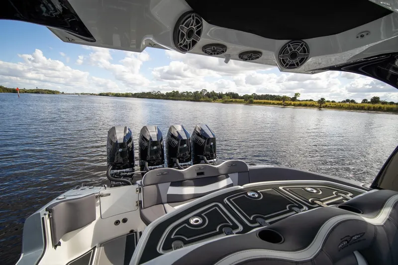 Slide: The Image of Luxury MTI V42 boat interior with quad engines on a scenic waterway, 2020 model. - 8