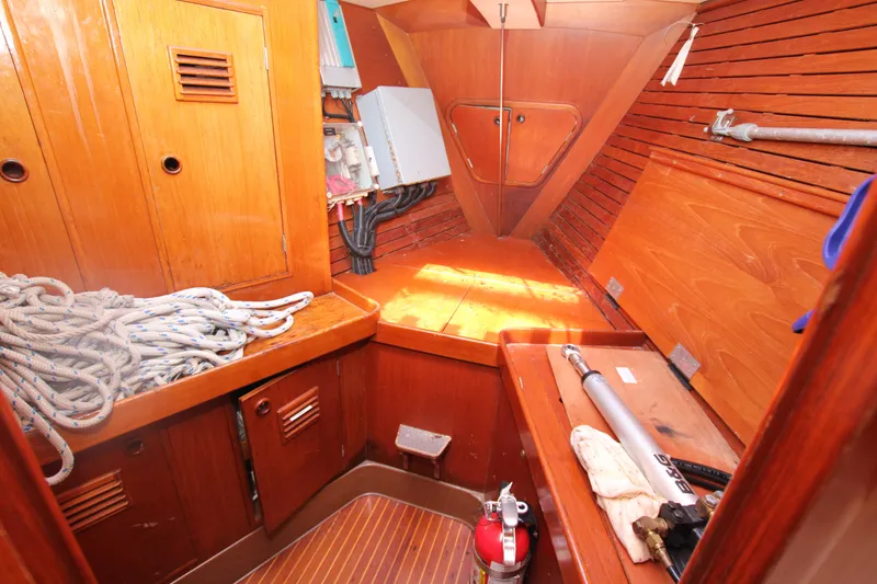 Slide: The Image of Interior of 1990 Nautor Swan 61 sailboat with wooden cabinetry and nautical equipment. - 20