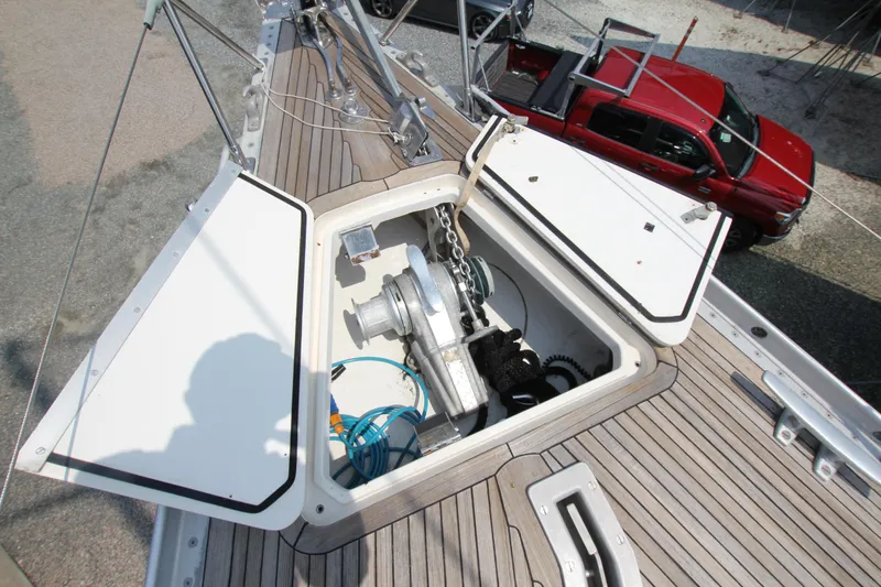 Slide: The Image of Open anchor locker on 1990 Nautor Swan 61 sailboat, showcasing winch and chain. - 3