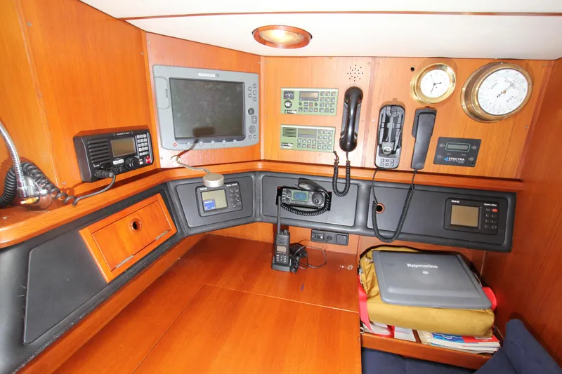 Slide: The Image of Navigation station of 1990 Nautor Swan 61 yacht with communication equipment and instruments. - 36
