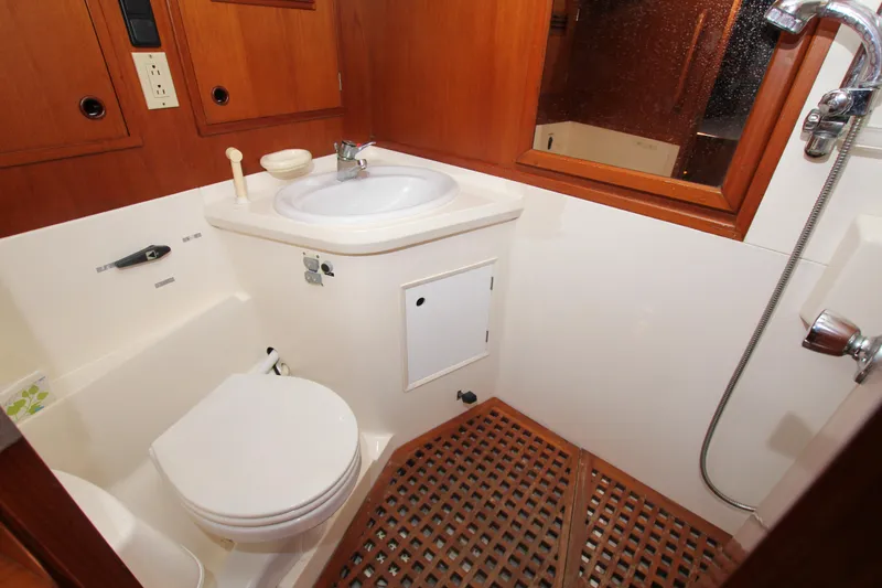 Slide: The Image of Bathroom interior of 1990 Nautor Swan 61 yacht with wooden accents and shower. - 41