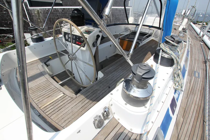 Slide: The Image of Cockpit of 1990 Nautor Swan 61 yacht with wooden deck and steering wheel. - 8