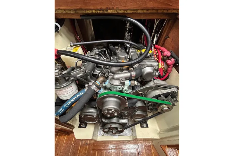 Slide: The Image of Engine compartment of a 1990 Pacific Seacraft PSC 37 sailboat, showing detailed components. - 10