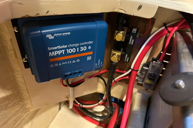 Slide: The Image of Victron Energy SmartSolar charge controller in 1990 Pacific Seacraft PSC 37 sailboat. - 12