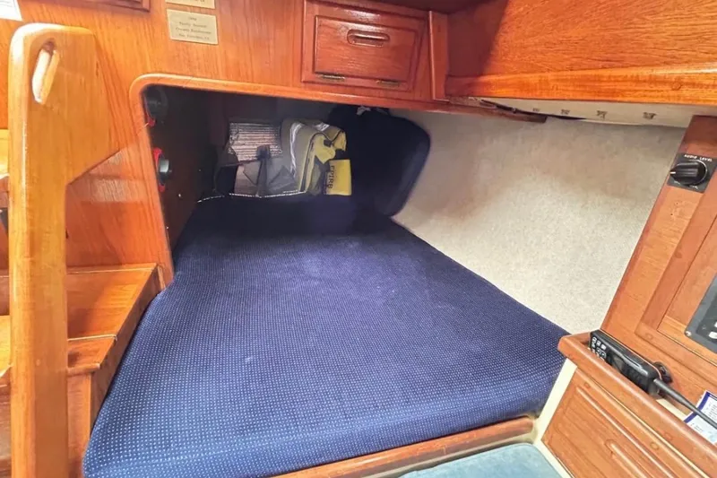 Slide: The Image of Cozy cabin interior of 1990 Pacific Seacraft PSC 37 sailboat with wooden finish. - 8