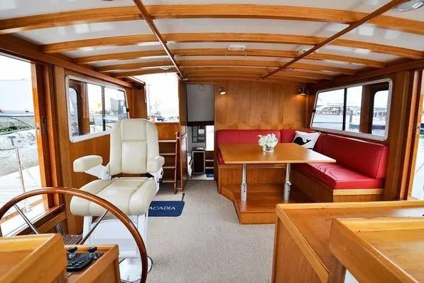 Slide: The Image of Luxurious 1987 Jarvis Newman 46' Flybridge Cruiser interior with elegant wood finish and seating. - 15