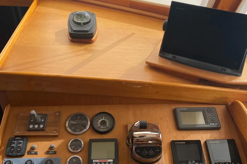 Slide: The Image of Control panel of a 1987 Jarvis Newman 46' Flybridge Cruiser with navigation instruments. - 24