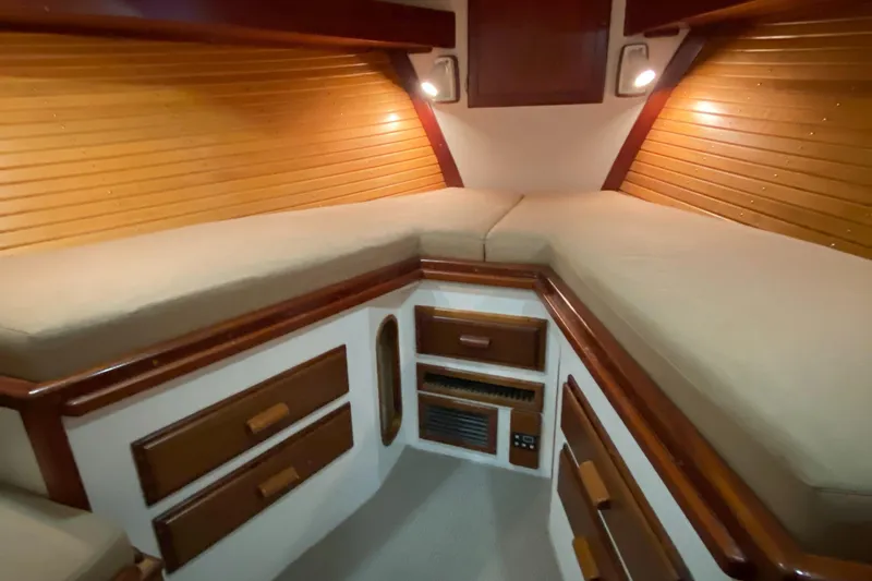 Slide: The Image of Interior cabin of 1987 Jarvis Newman 46' Flybridge Cruiser with wood paneling and built-in storage. - 27