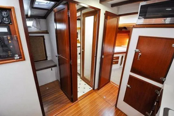 Slide: The Image of 1987 Jarvis Newman 46' Flybridge Cruiser interior with wood paneling and cabinetry. - 29