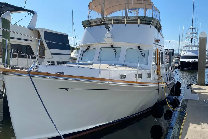 Slide: The Image of 1987 Jarvis Newman Lyman Morse 46' Flybridge Cruiser docked at marina. - 3