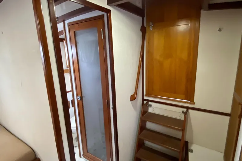 Slide: The Image of Interior of 1987 Jarvis Newman 46' Flybridge Cruiser with wooden stairs and door. - 50