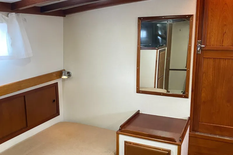 Slide: The Image of Interior of 1987 Jarvis Newman 46' Flybridge Cruiser with wood accents and mirror. - 51