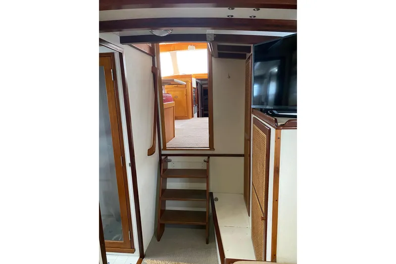 Slide: The Image of Interior of 1987 Jarvis Newman 46' Flybridge Cruiser with wooden stairs and modern amenities. - 54