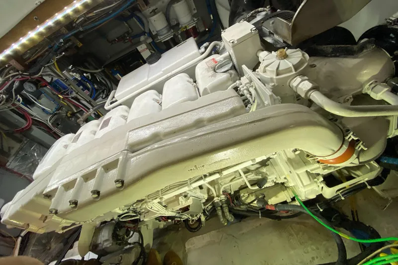 Slide: The Image of Engine room of 1987 Jarvis Newman 46' Flybridge Cruiser, showcasing detailed machinery and components. - 68