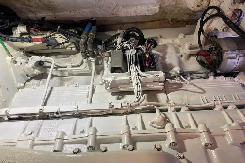 Slide: The Image of Engine compartment of 1987 Jarvis Newman 46' Flybridge Cruiser, showcasing wiring and components. - 69