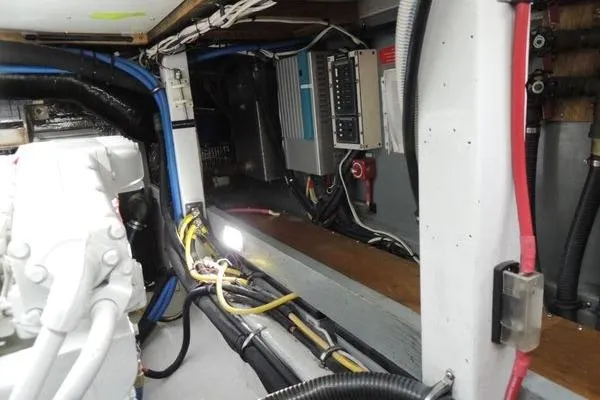 Slide: The Image of Engine room of 1987 Jarvis Newman 46' Flybridge Cruiser with visible wiring and equipment. - 71
