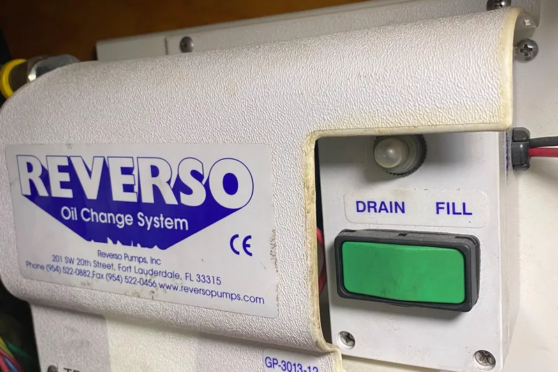 Slide: The Image of Reverso oil change system on 1987 Jarvis Newman 46' Flybridge Cruiser, featuring drain and fill controls. - 74