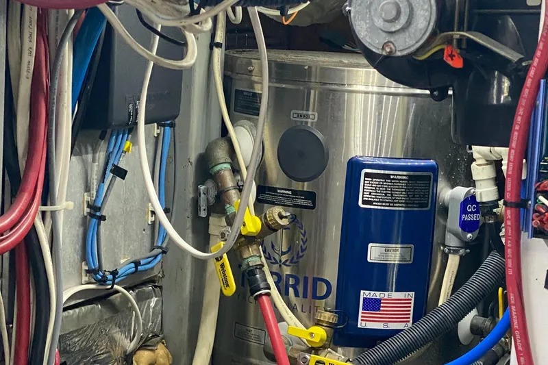 Slide: The Image of Engine room of 1987 Jarvis Newman 46' Flybridge Cruiser with wiring and equipment. - 77