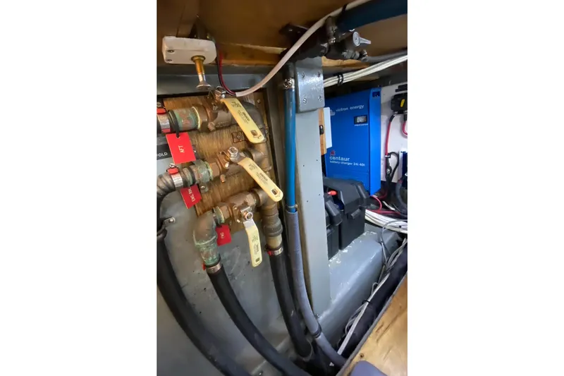 Slide: The Image of Engine room of 1987 Jarvis Newman 46' Flybridge Cruiser with plumbing and electrical systems. - 78