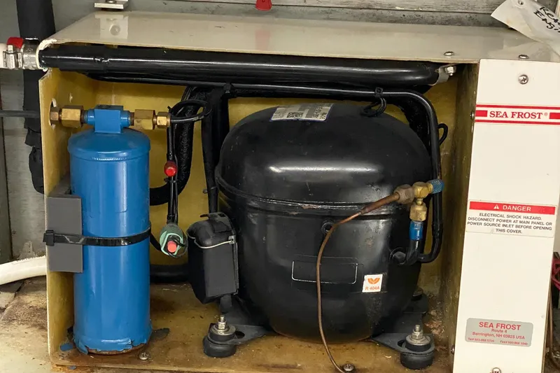 Slide: The Image of Engine room of 1987 Jarvis Newman 46' Flybridge Cruiser with Sea Frost refrigeration unit. - 85