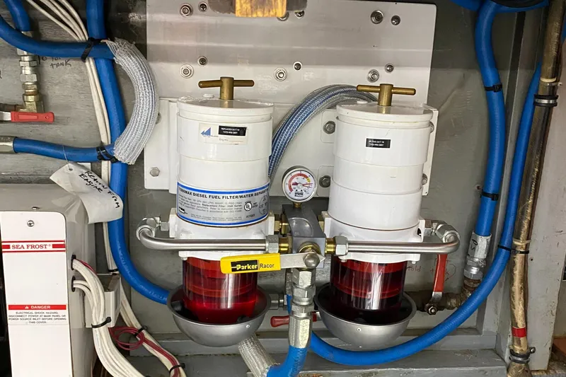 Slide: The Image of Diesel fuel filter system in a 1987 Jarvis Newman 46' Flybridge Cruiser engine room. - 86