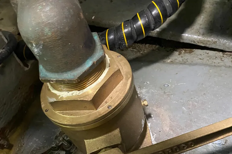 Slide: The Image of Close-up of a brass fitting in a 1987 Jarvis Newman 46' Flybridge Cruiser. - 90