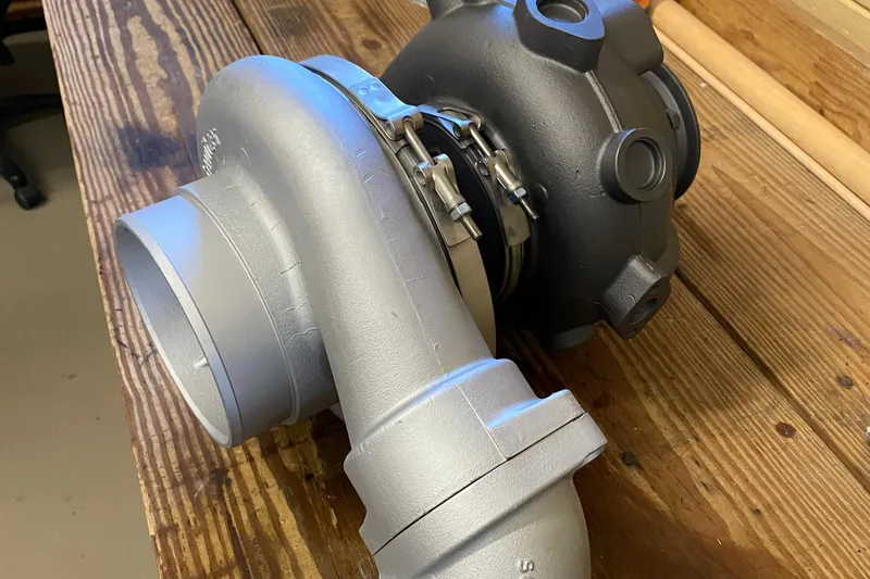 Slide: The Image of Turbocharger on wooden table, related to 1987 Jarvis Newman/Lyman Morse 46' Flybridge Cruiser. - 91