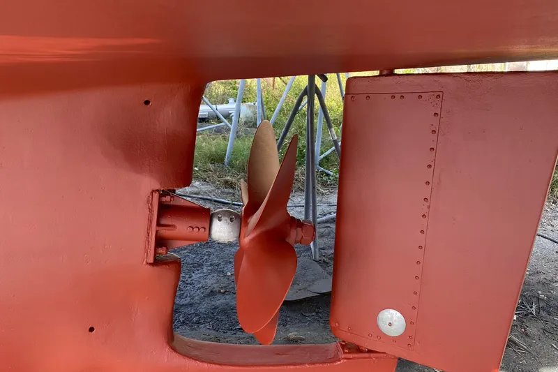 Slide: The Image of Propeller and rudder of 1987 Jarvis Newman 46' Flybridge Cruiser, painted in red. - 93