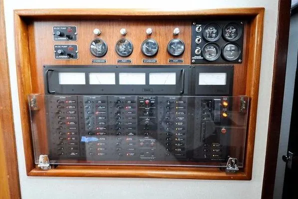 Slide: The Image of Electrical control panel of 1987 Jarvis Newman 46' Flybridge Cruiser with gauges and switches. - 95