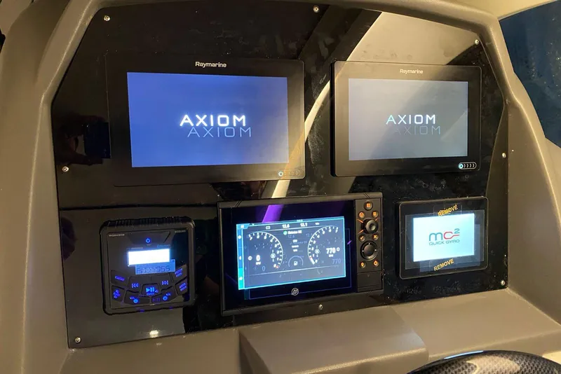 Slide: The Image of Control panel of a 2026 Hanover 375 with multiple digital displays and navigation systems. - 6