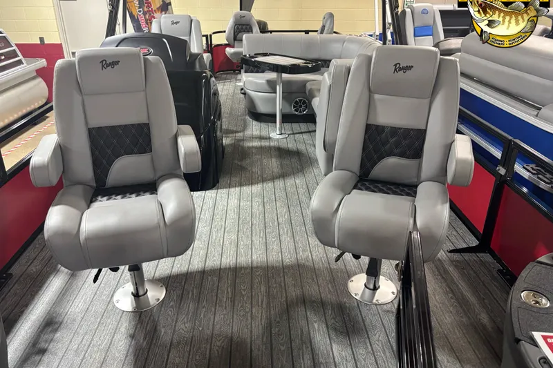 Slide: The Image of 2026 Ranger Reata 220F boat interior with plush seating and modern design. - 2