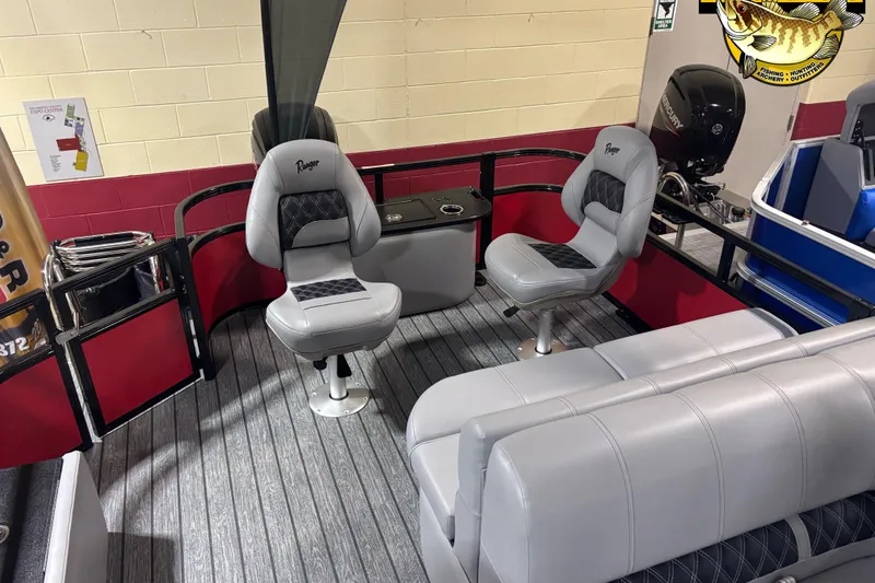 Slide: The Image of 2026 Ranger Reata 220F boat interior with gray seating and modern design. - 4