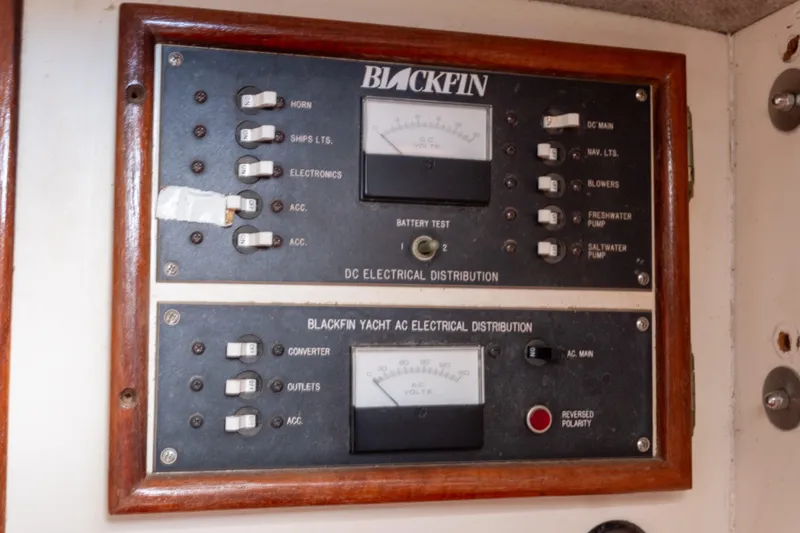 Slide: The Image of Electrical panel of a 1989 Blackfin 272 CC boat, featuring DC and AC distribution. - 10