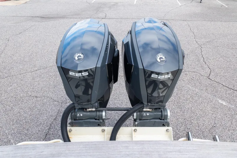 Slide: The Image of Twin 225 horsepower outboard engines on a 1989 Blackfin 272 CC boat. - 6