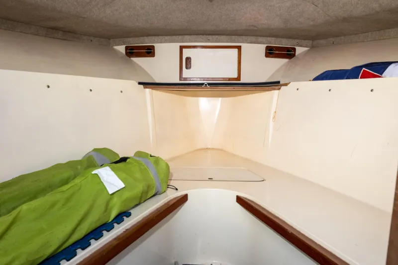 Slide: The Image of Interior cabin of 1989 Blackfin 272 CC boat with storage and sleeping area. - 9