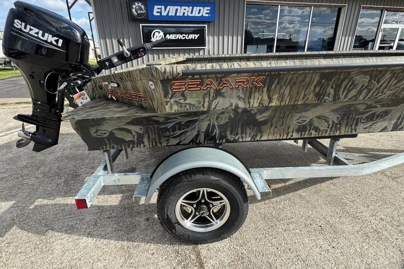 Slide: The Image of 2026 SeaArk 1752 Slayer X Pro boat with Suzuki motor on trailer. - 10