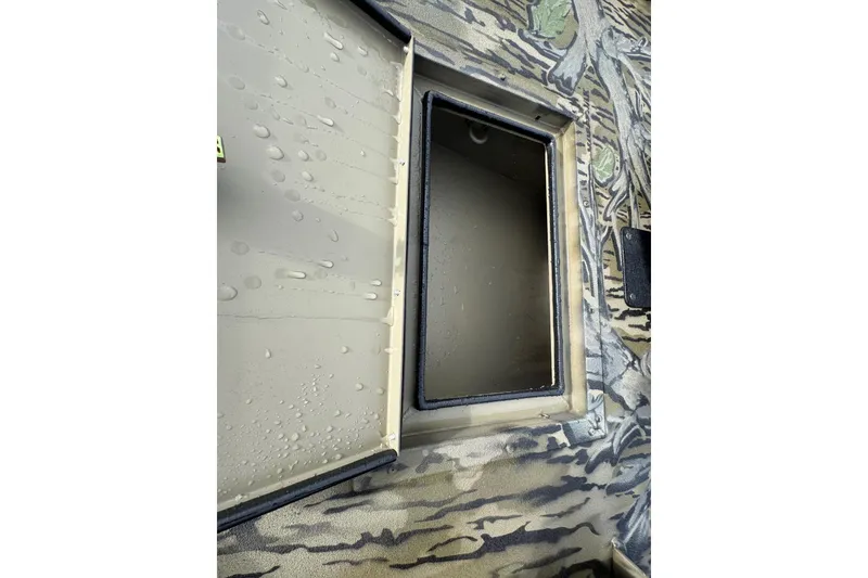 Slide: The Image of Close-up of 2026 SeaArk 1752 Slayer X Pro boat compartment with camouflage design. - 17