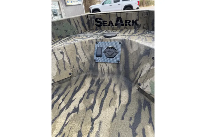 Slide: The Image of 2026 SeaArk 1752 Slayer X Pro boat with camouflage interior design. - 6