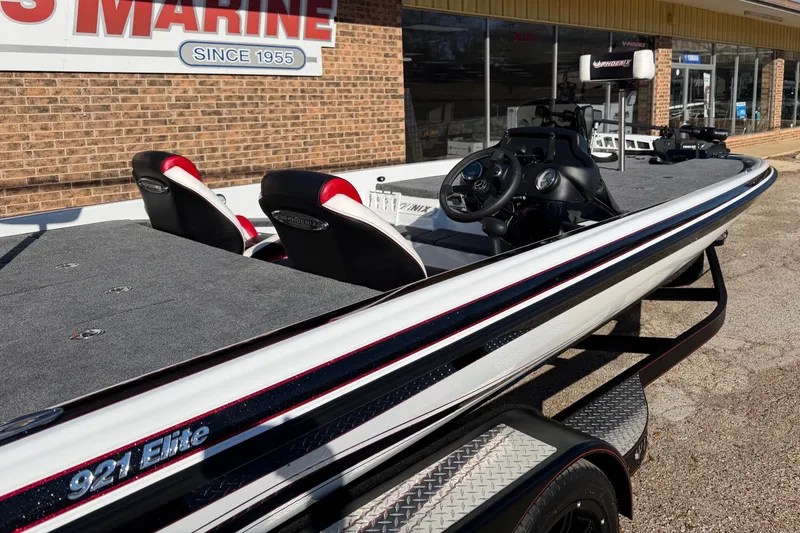 Slide: The Image of 2024 Phoenix 921 Elite II boat displayed outside a marine store. - 3
