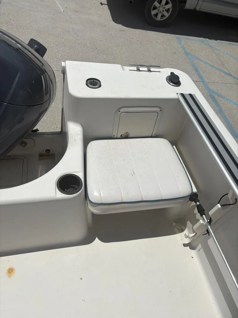 Slide: The Image of 1996 Pro-Line 202 boat interior with seating and storage compartments. - 12